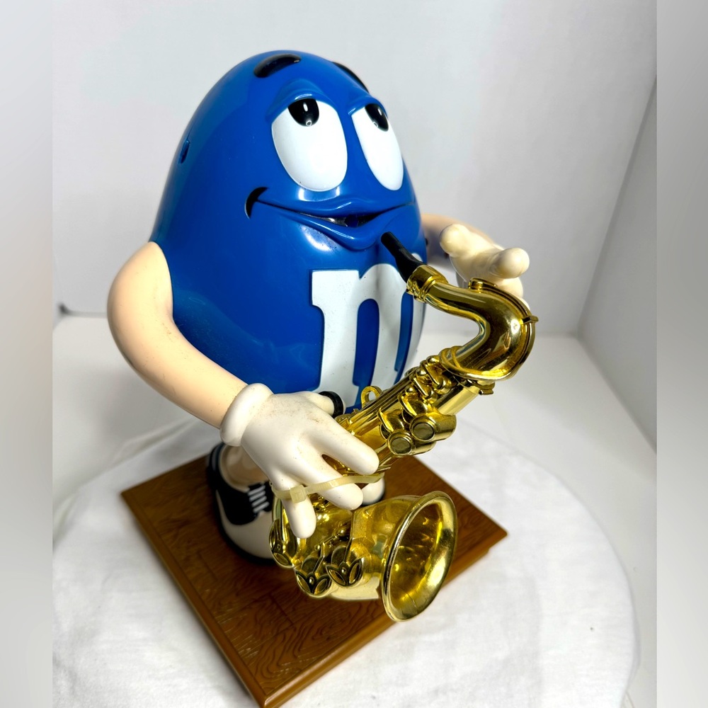Vintage Blue M&M Candy Dispenser with a Saxophone. (C)
